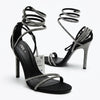 Sandale à talons noire avec brides à strass