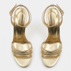 Sandales dorées à brides et talons hauts